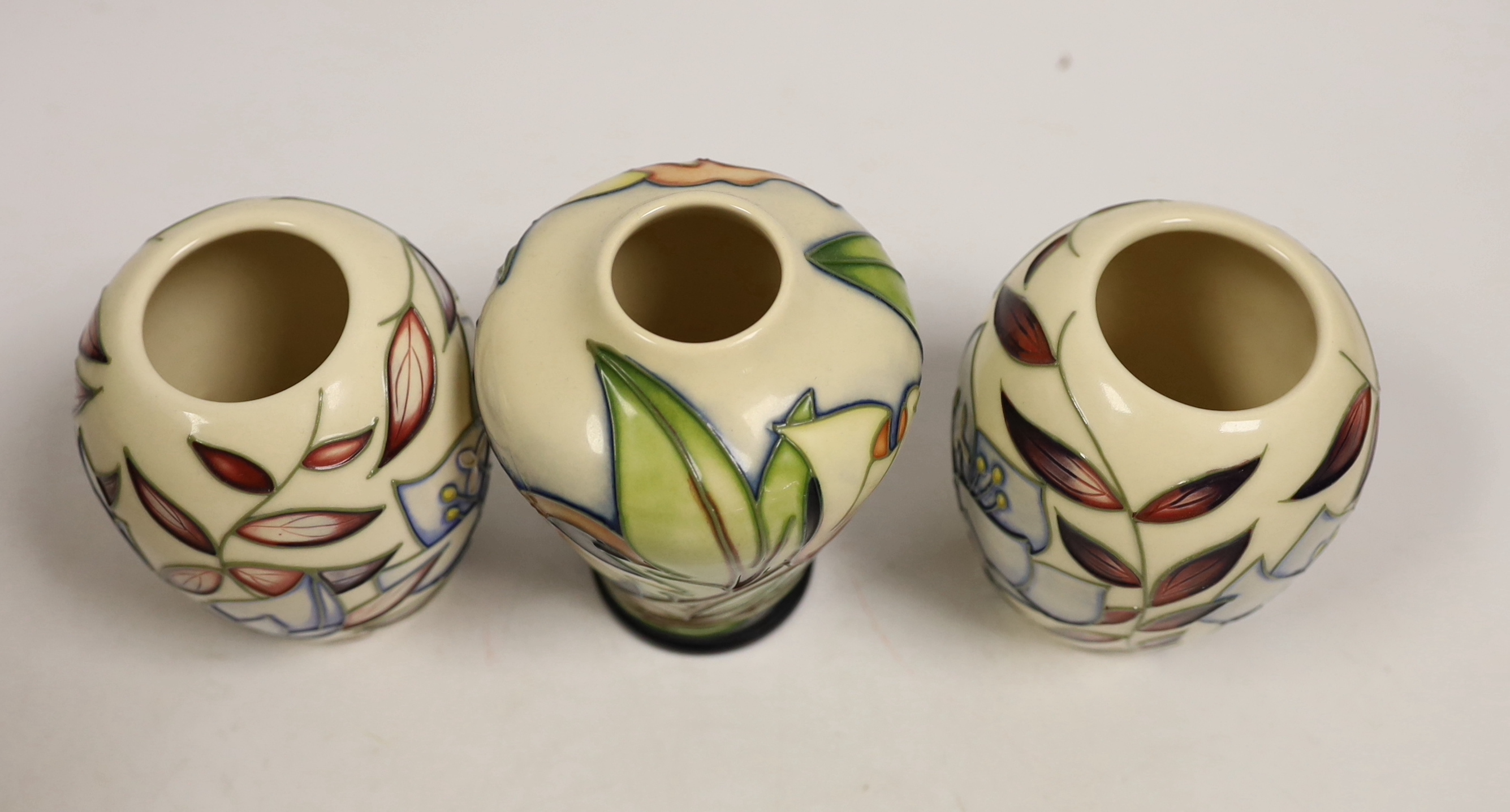 Seven small Moorcroft vases, various patterns. Tallest 10cm